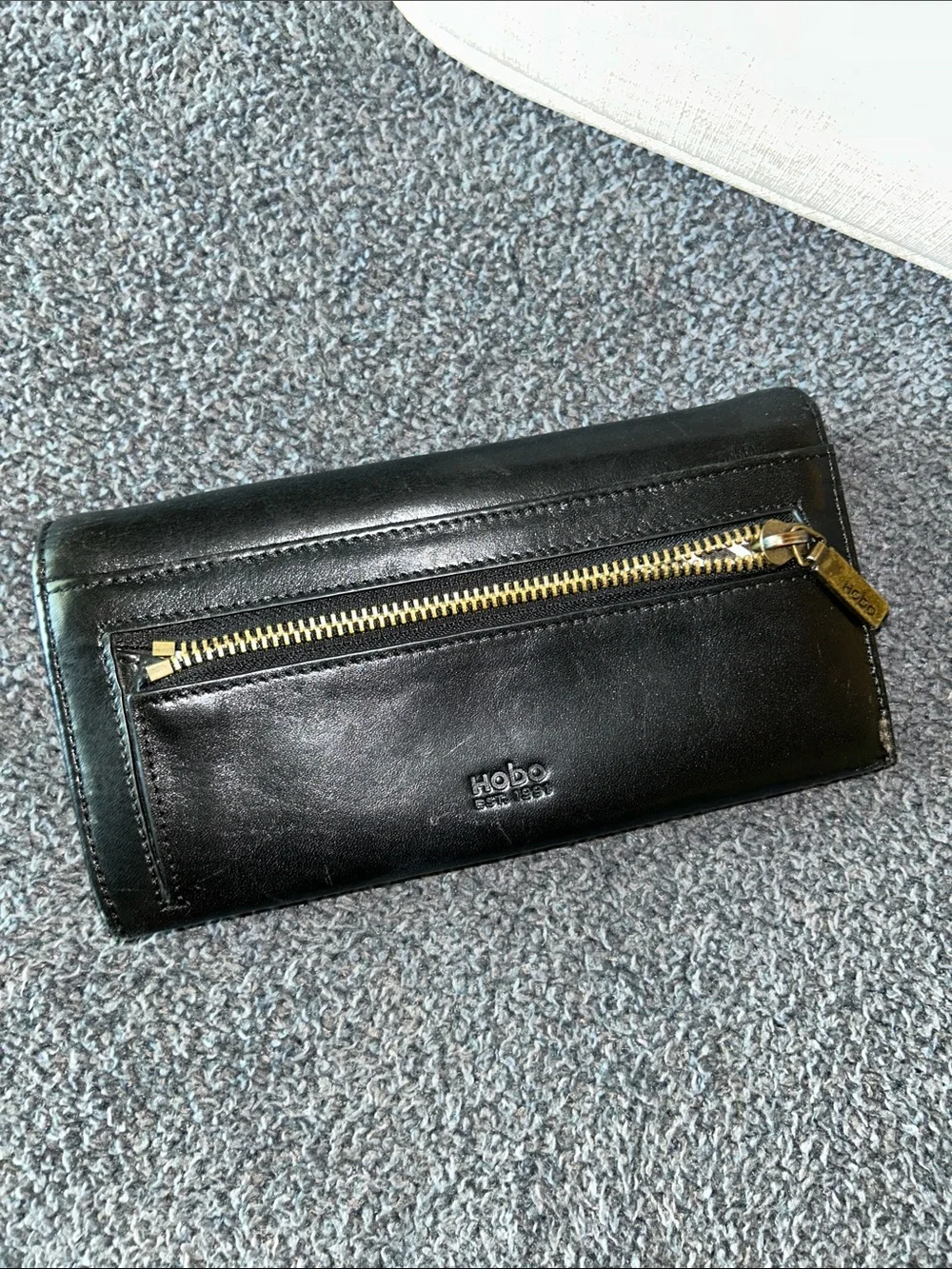 HOBO Black Leather Phone Wallet with Brass-Tone and houndstooth interior